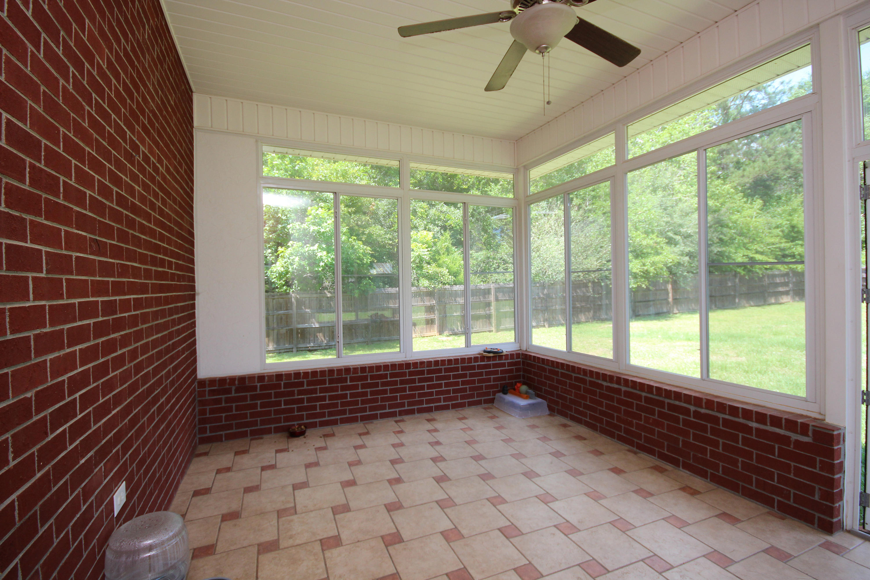 5819 Roberts Road Crestview, FL 32536 - Photo 24 of 36 a view of empty room with wooden floor and fan