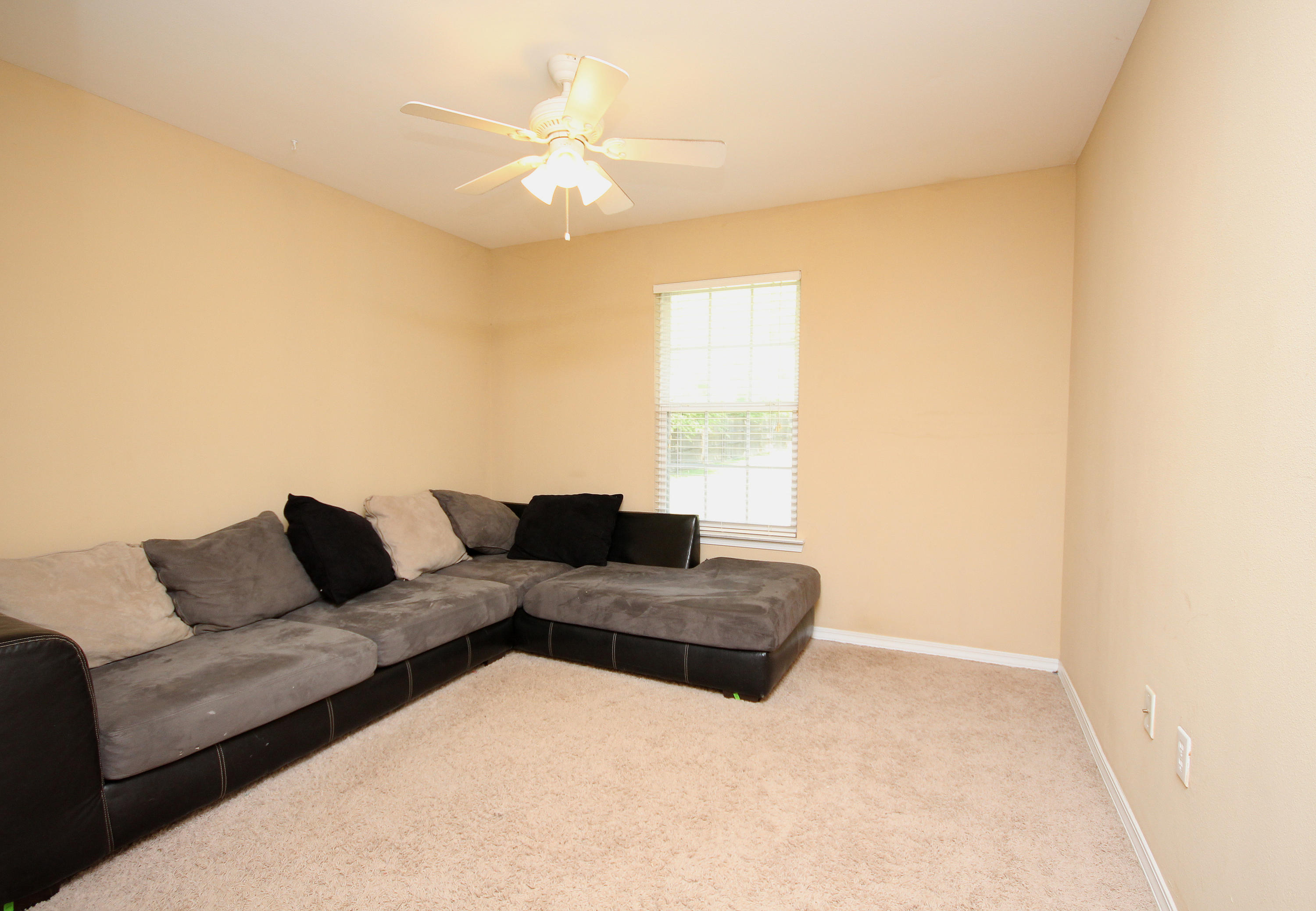 5819 Roberts Road Crestview, FL 32536 - Photo 27 of 36 a living room with furniture and a large window