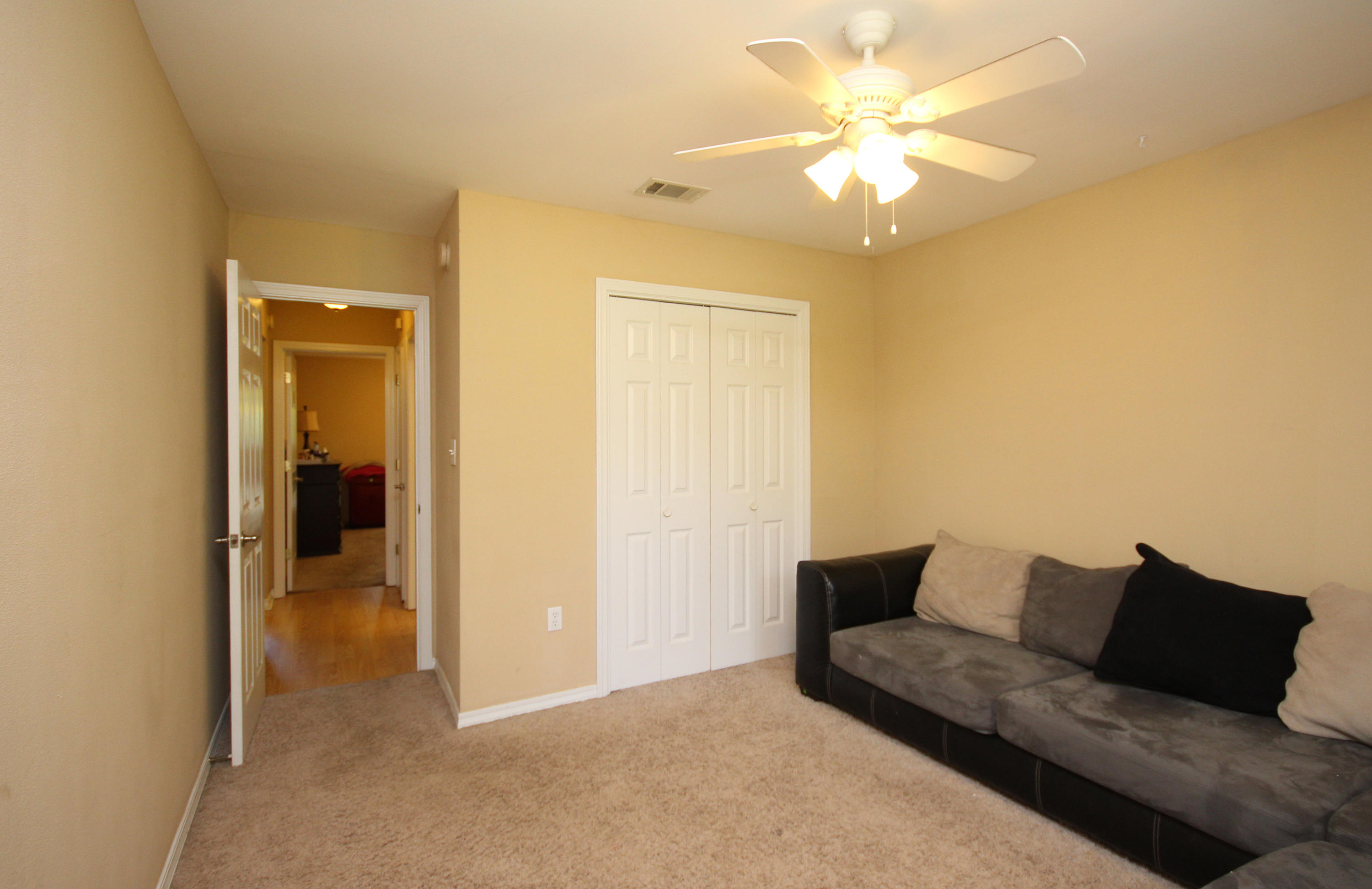 5819 Roberts Road Crestview, FL 32536 - Photo 28 of 36 a living room with furniture and a ceiling fan