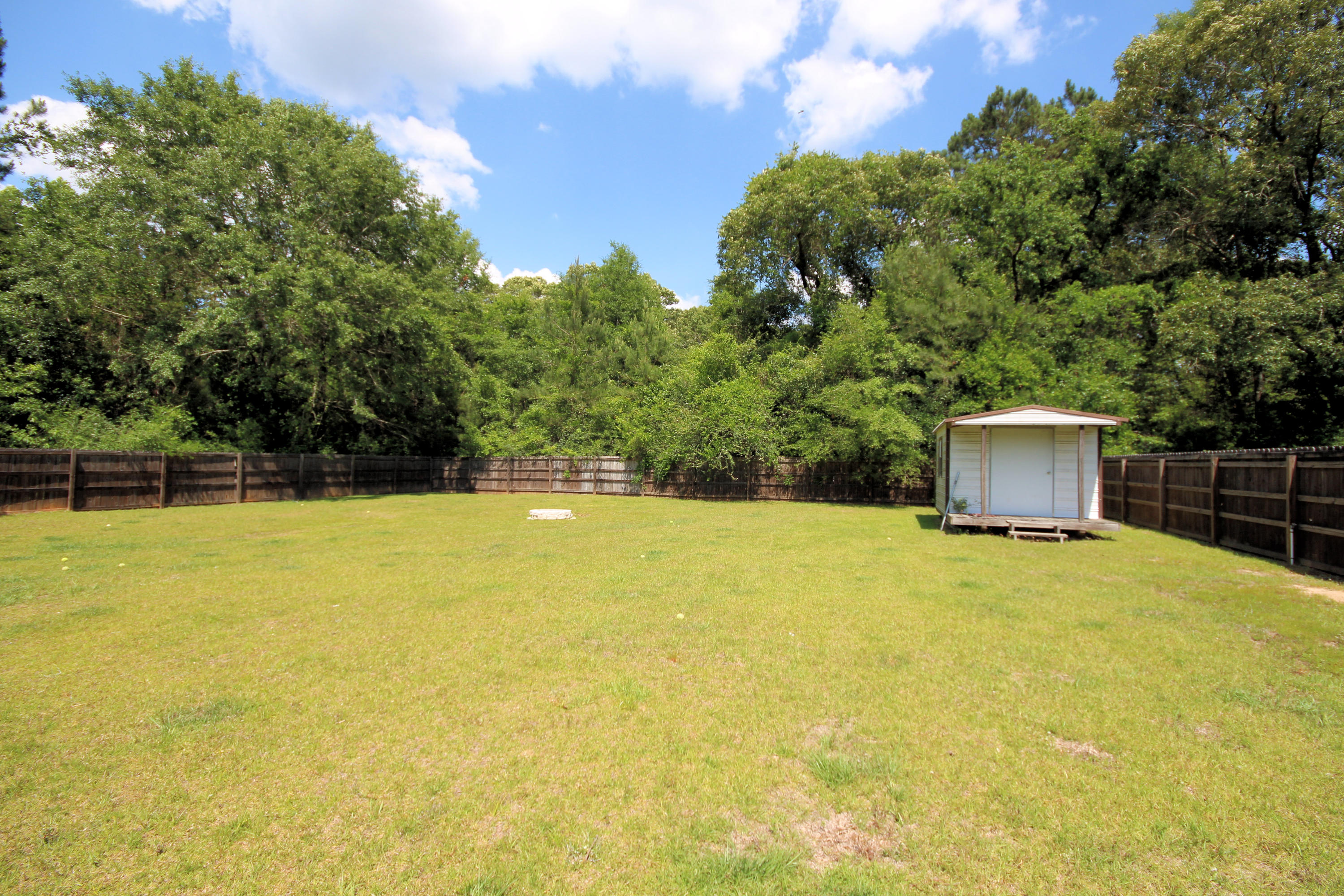 5819 Roberts Road Crestview, FL 32536 - Photo 34 of 36 a house with a trees in the background