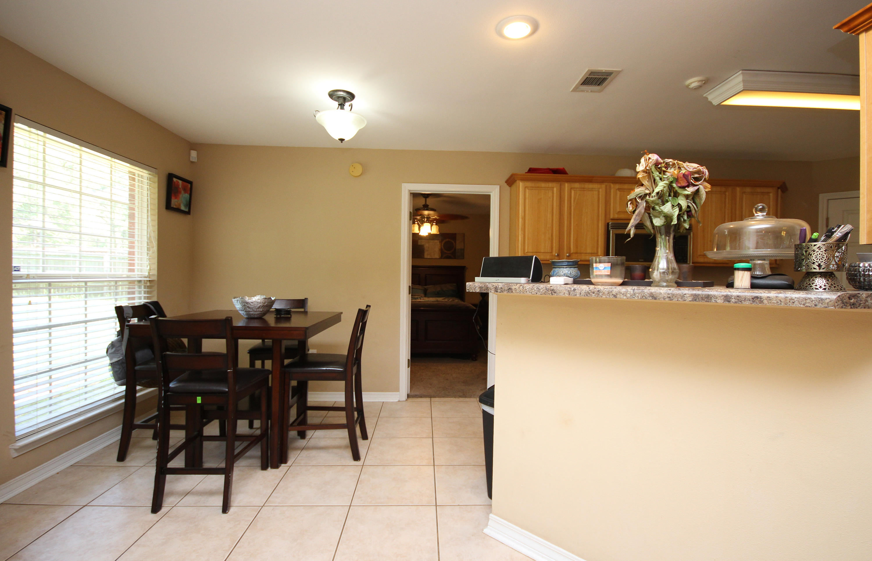 5819 Roberts Road Crestview, FL 32536 - Photo 9 of 36 a kitchen with a table and chairs in it