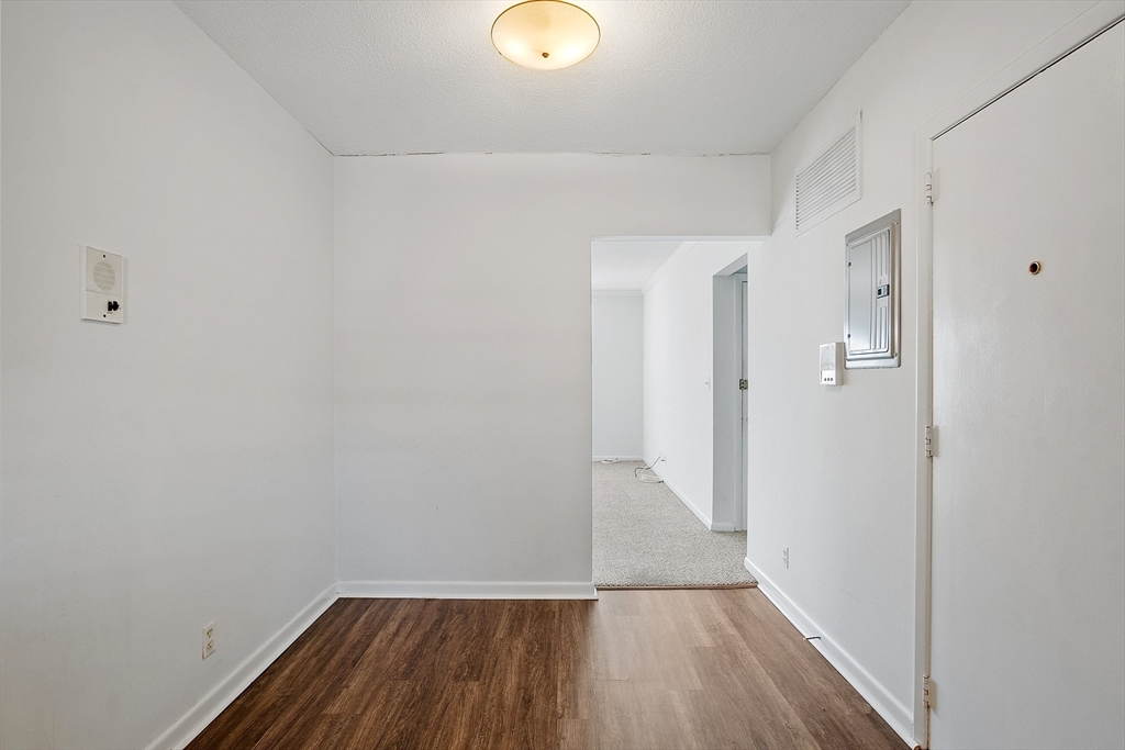 170 Lake Shore Road, Unit 4 Boston, MA 02135 - Photo 8 of 36 a view of a room with wooden floor