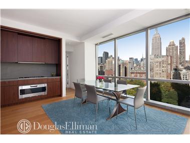 23 East 22nd Street, Unit 18B Manhattan, NY 10010 - Photo 1 of 1 a living room with furniture and a wooden floor
