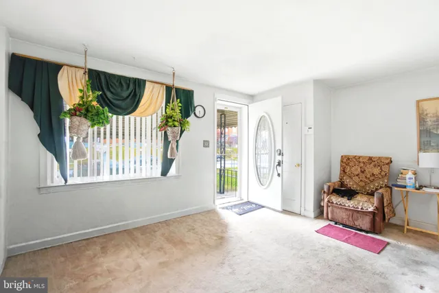 a view of livingroom with furniture and window