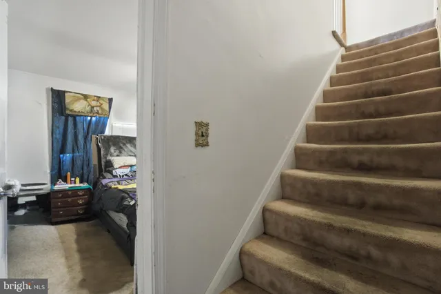 a bedroom with a bed and dresser