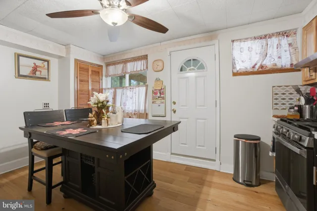 a kitchen with stainless steel appliances granite countertop a stove a sink and cabinets