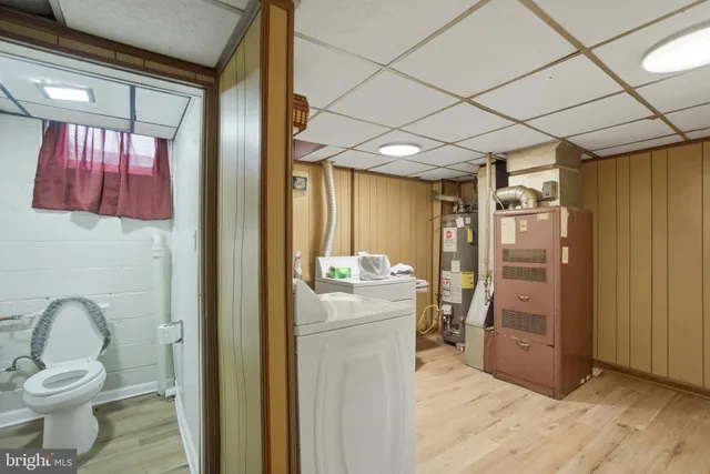 a storage room with wooden floor and furniture