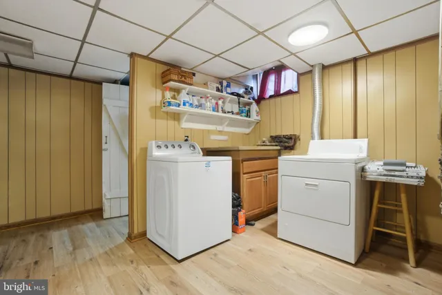 a front view of a brick house with a large windows