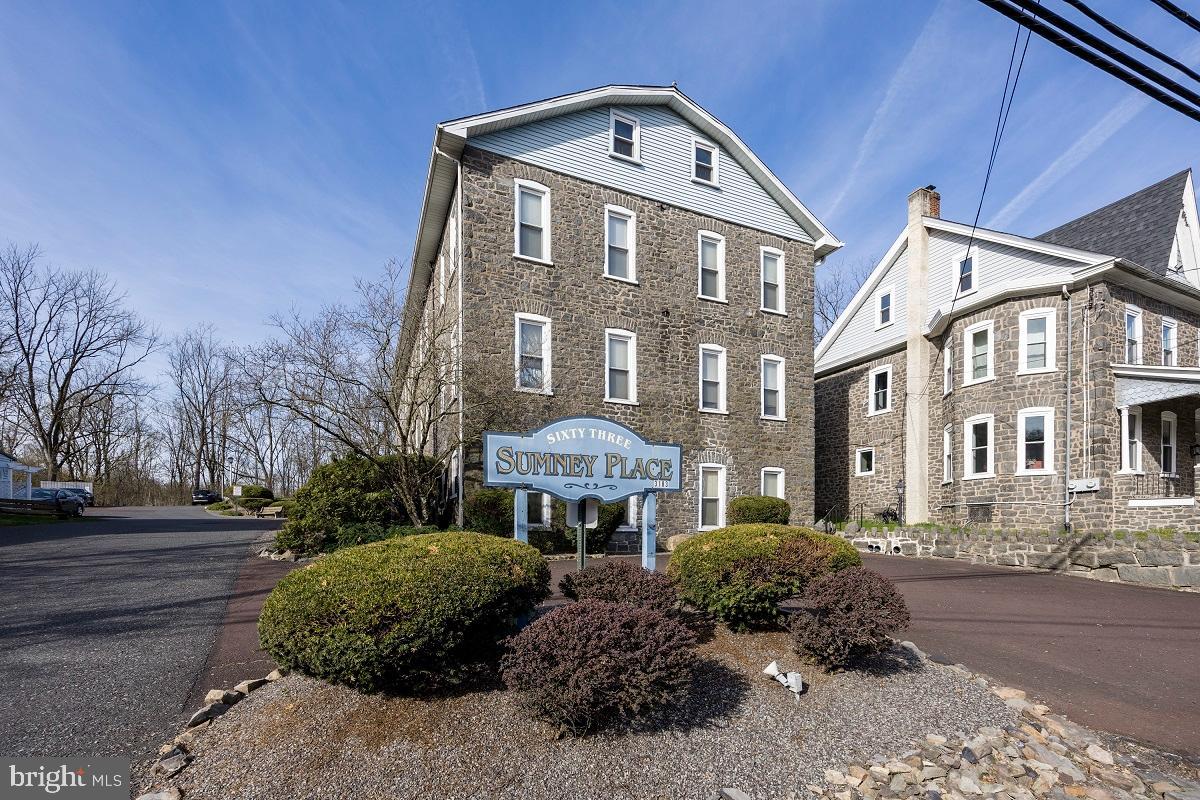 3183 Main Street, Unit 3 Green Lane, PA 18054 - Photo 1 of 28 a front view of a residential apartment building with a yard