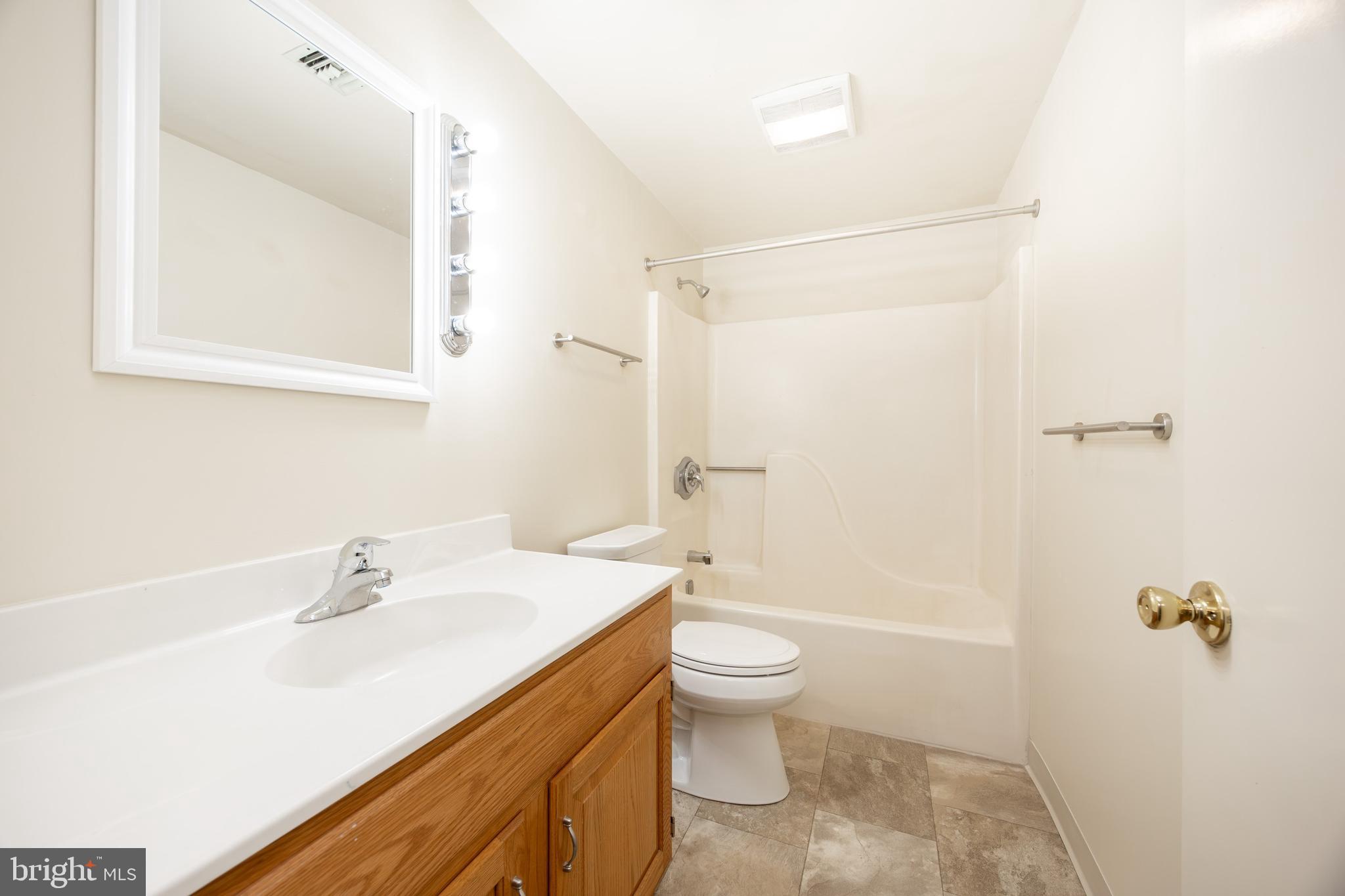 3183 Main Street, Unit 3 Green Lane, PA 18054 - Photo 16 of 28 a bathroom with a sink a toilet and shower