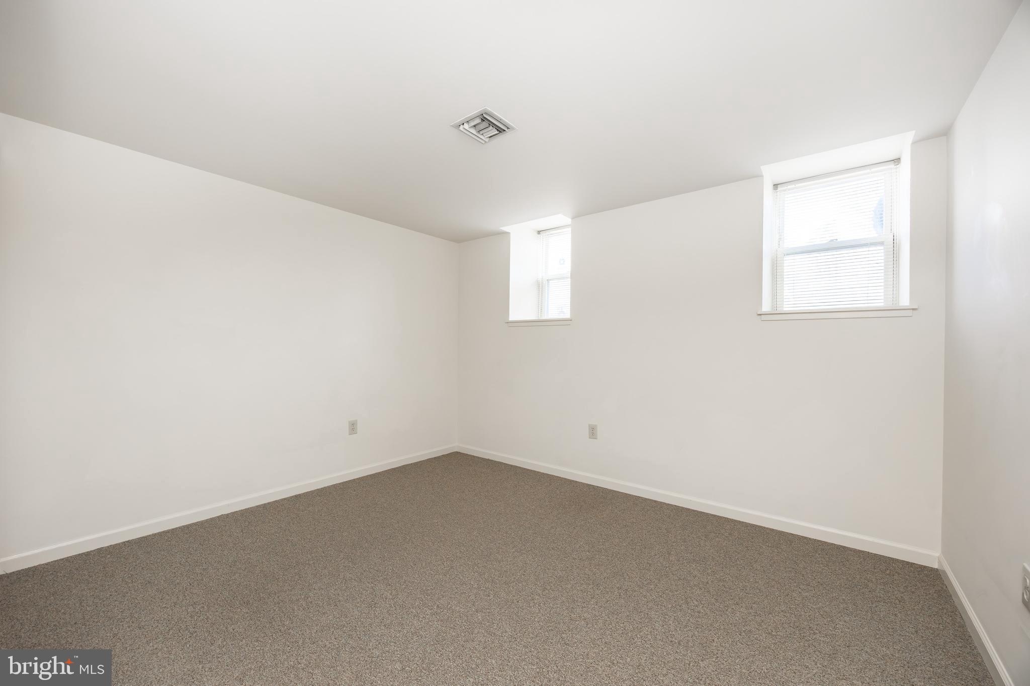 3183 Main Street, Unit 3 Green Lane, PA 18054 - Photo 22 of 28 an empty room with a window