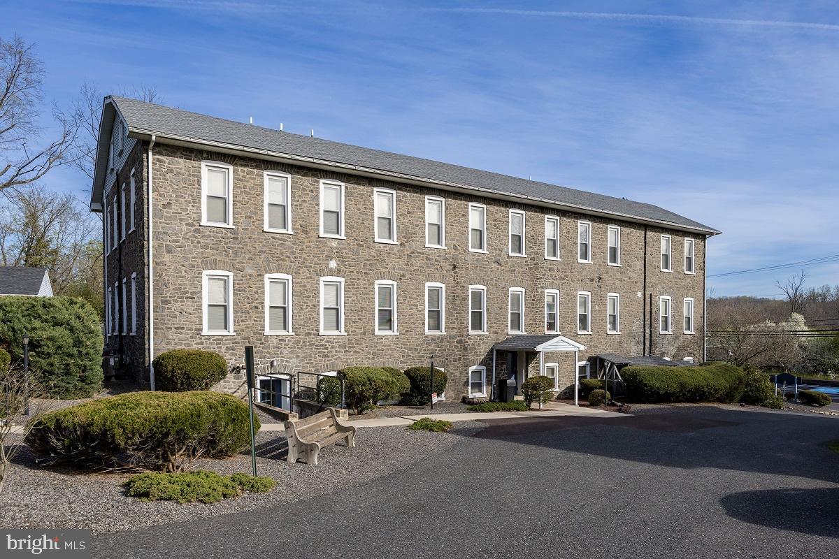 3183 Main Street, Unit 3 Green Lane, PA 18054 - Photo 25 of 28 a front view of a building with street
