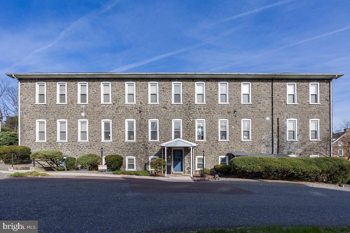 3183 Main Street, Unit 3 Green Lane, PA 18054 - Photo 27 of 28 a front view of building with yard and green space