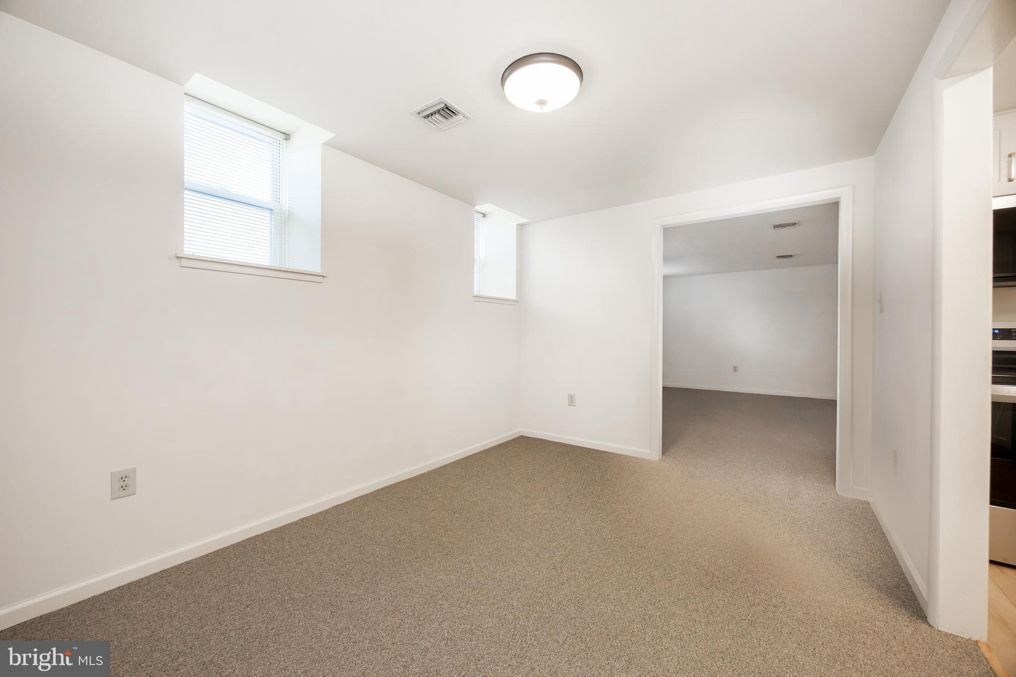 3183 Main Street, Unit 3 Green Lane, PA 18054 - Photo 8 of 28 an empty room with a window and a ceiling fan