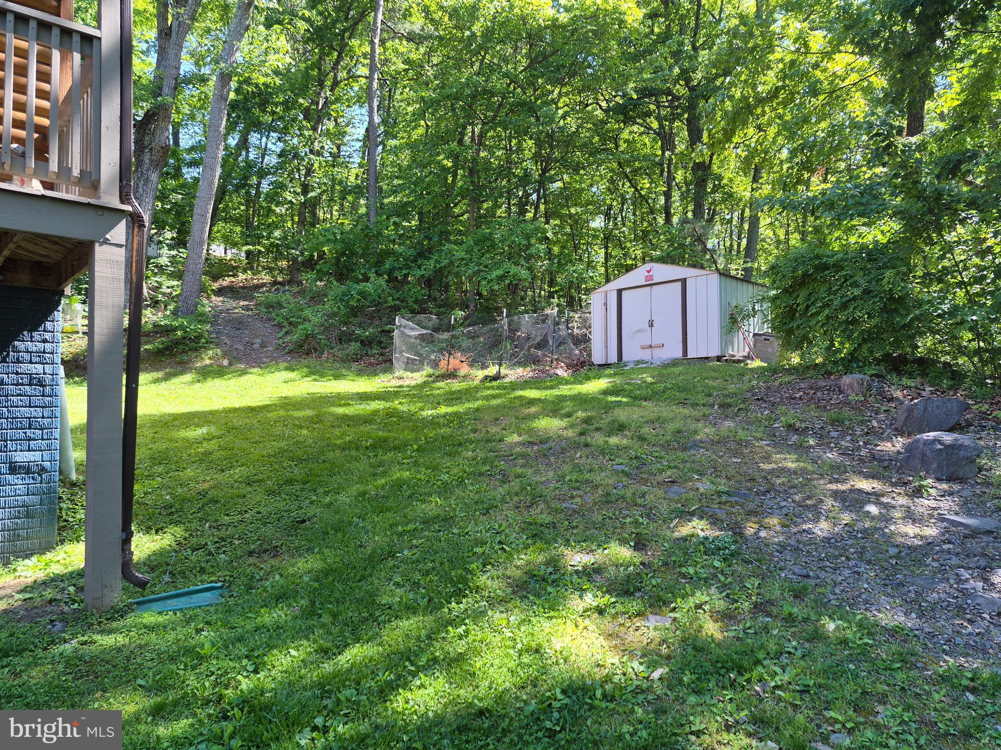 1440 Drummer Hill Road Front Royal, VA 22630 - Photo 15 of 42 a backyard of a house with lots of green space and fountain