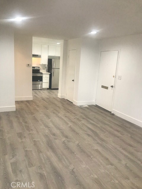 2155 Canyon Drive, Unit A Costa Mesa, CA 92627 - Photo 3 of 10 a view of a kitchen with a sink and cabinets