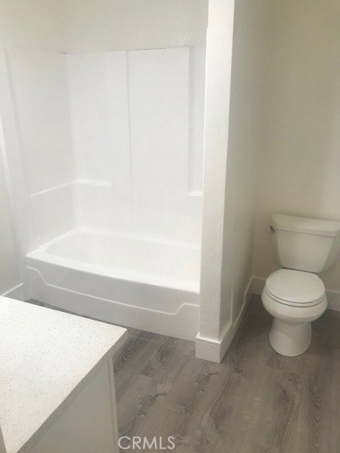 2155 Canyon Drive, Unit A Costa Mesa, CA 92627 - Photo 6 of 10 a bathroom with a toilet and a bathtub