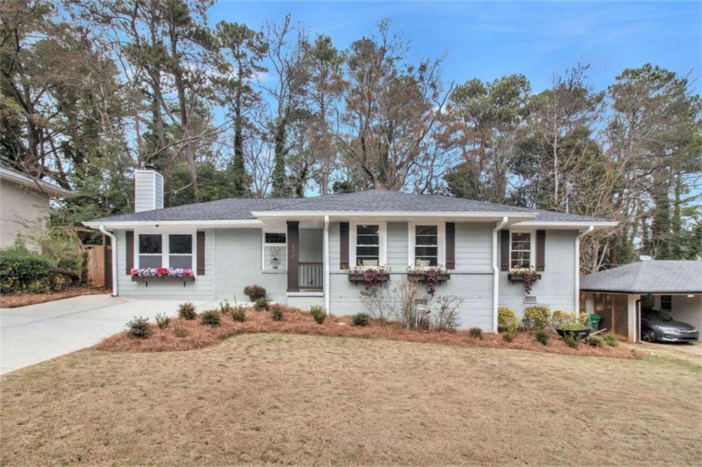 2112 Trailwood Road Decatur, GA 30032 - Photo 1 of 1 a front view of house with yard outdoor seating and barbeque oven