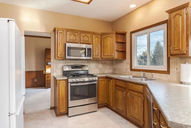 a view of a storage and utility room with washer and dryer