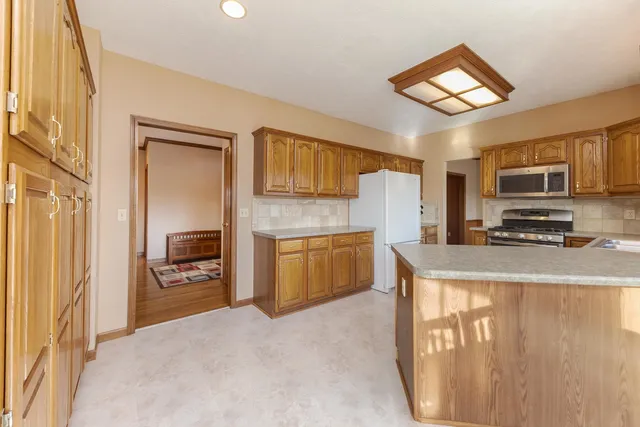 a bedroom with a large bed closet and flat screen tv