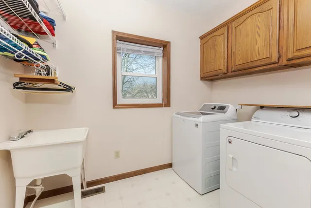a spacious bathroom with a double vanity sink mirror and double