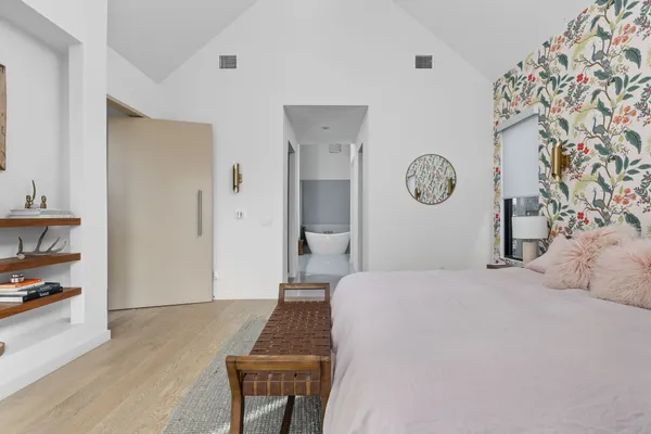 a living room with furniture and a lamp