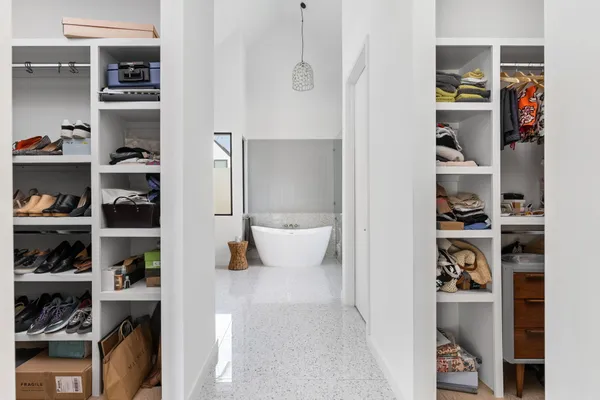 a bedroom with a bed and a cabinets