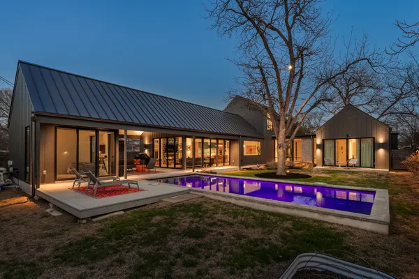 a view of swimming pool with an outdoor seating