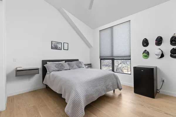 a bedroom with a bed and a dresser