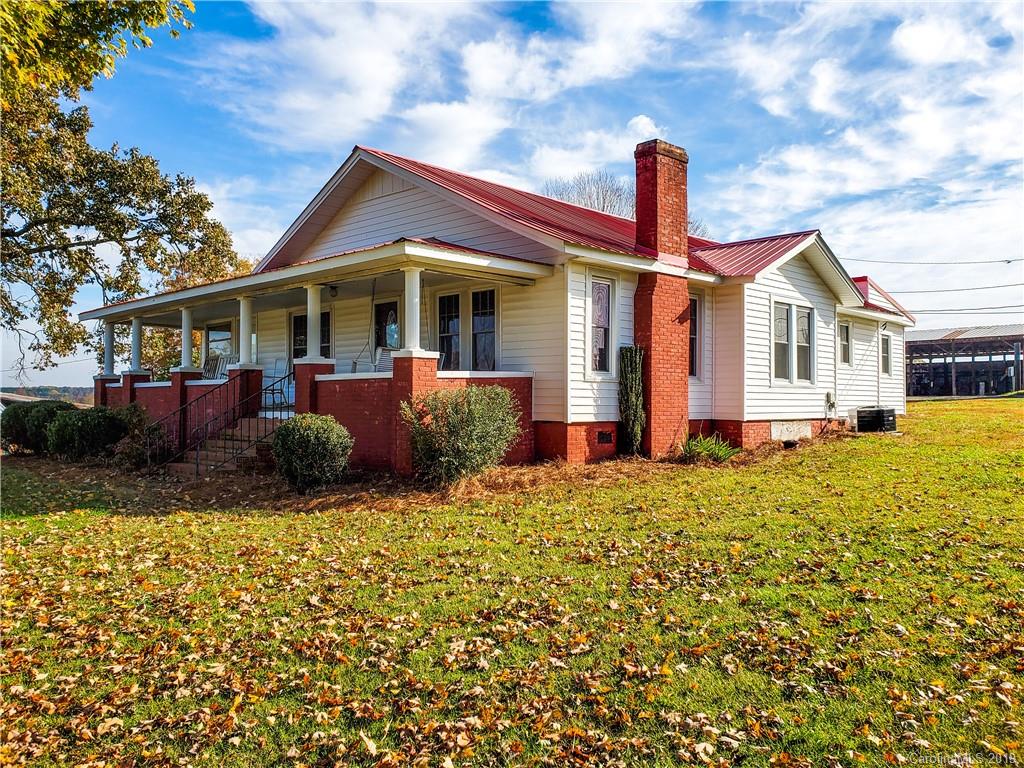 7405 Houser Farm Road Vale, NC 28168 - Photo 1 of 28 a front view of a house with a yard
