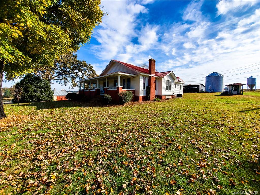 7405 Houser Farm Road Vale, NC 28168 - Photo 22 of 28 a front view of a house with a garden