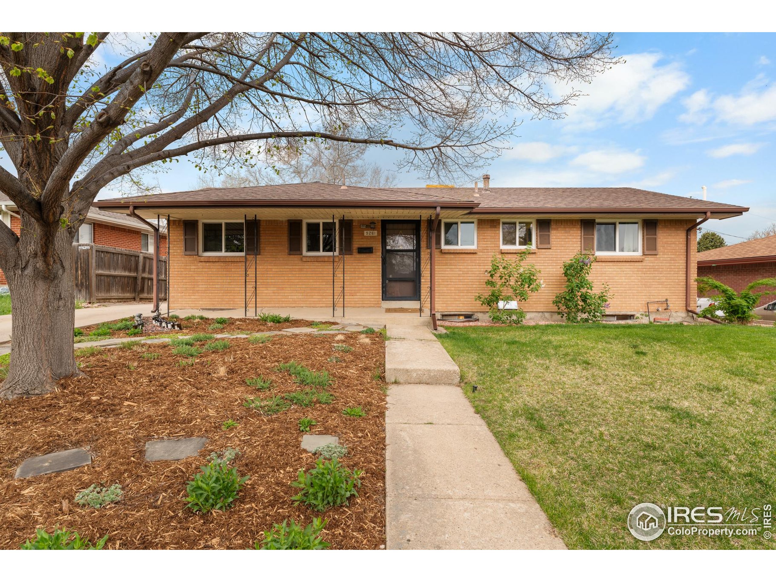 9261 Julian Way Westminster, CO 80031 - Photo 1 of 33 a front view of a house with garden