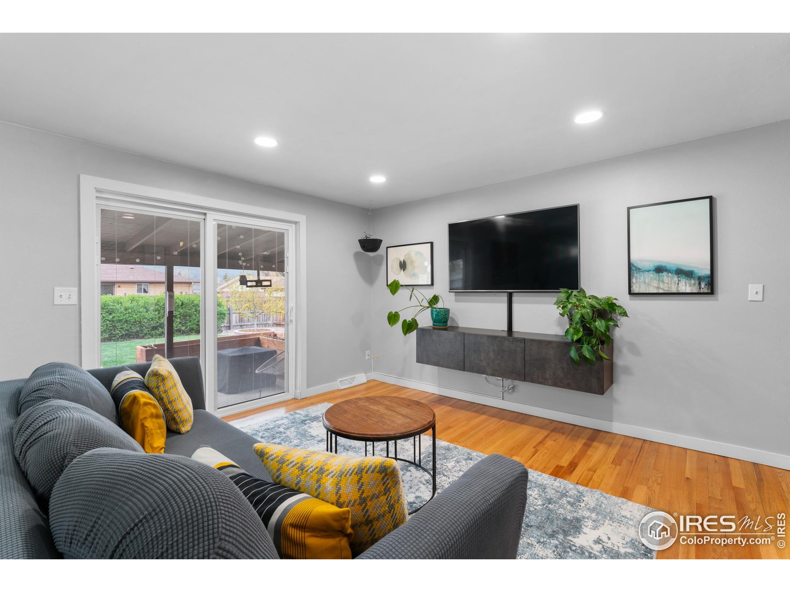 9261 Julian Way Westminster, CO 80031 - Photo 11 of 33 a living room with furniture and a flat screen tv