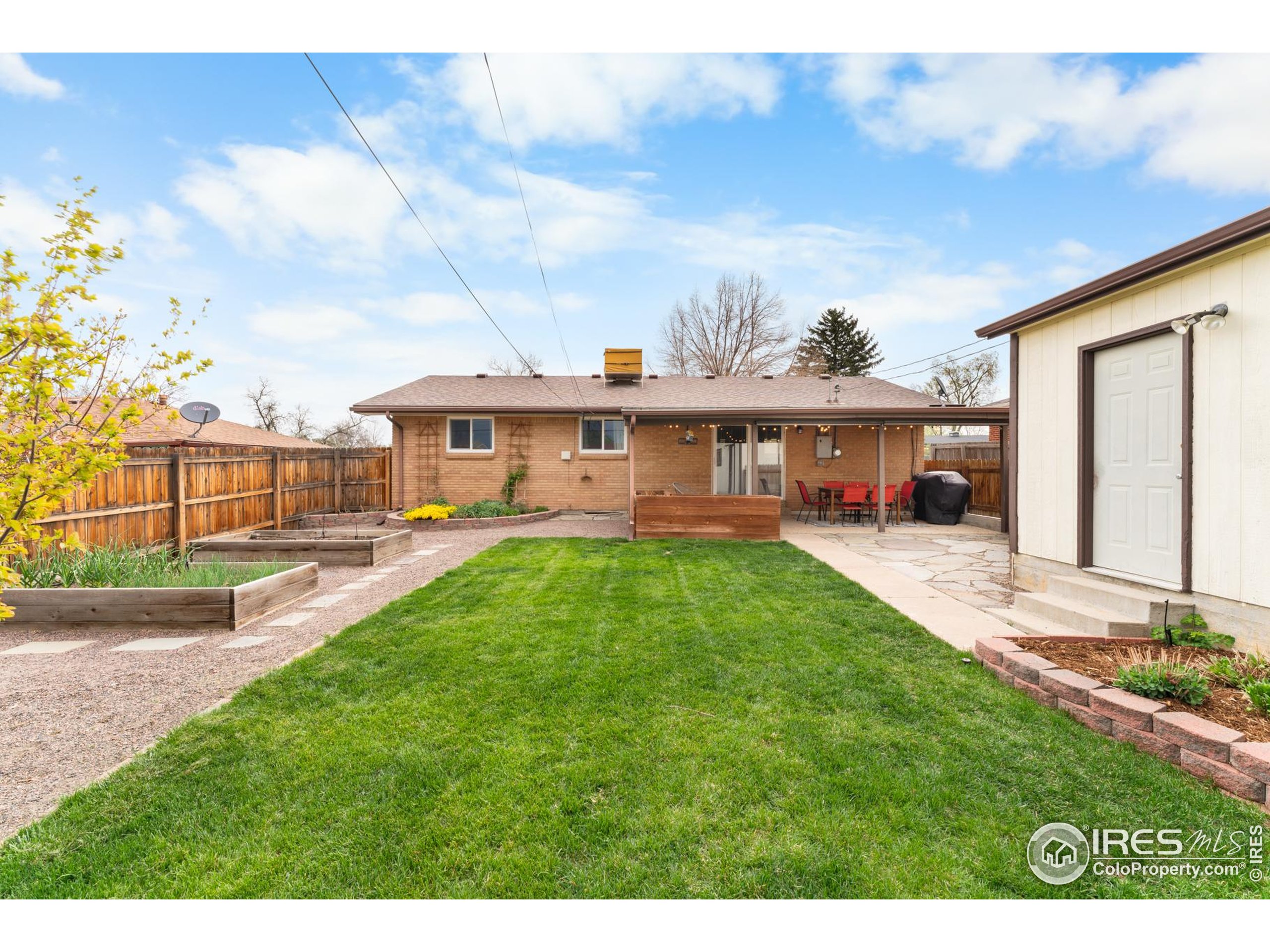 9261 Julian Way Westminster, CO 80031 - Photo 28 of 33 a view of a house with a big yard plants and large trees