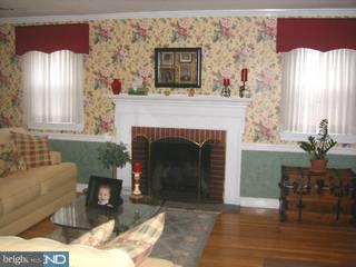 269 Madison Road Huntingdon Valley, PA 19006 - Photo 5 of 6 a living room with furniture and a fireplace
