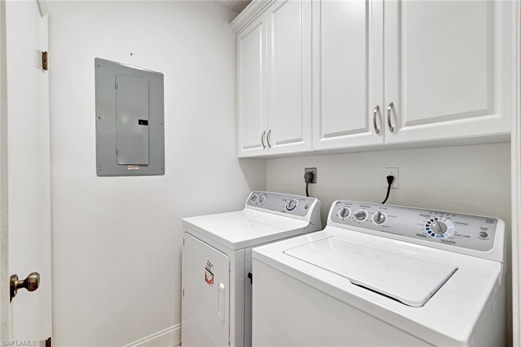 109 Tuscana Court, Unit 308 Naples, FL 34119 - Photo 14 of 18 a utility room with dryer and washer