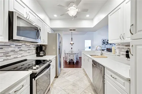 a kitchen with a stove microwave and a refrigerator