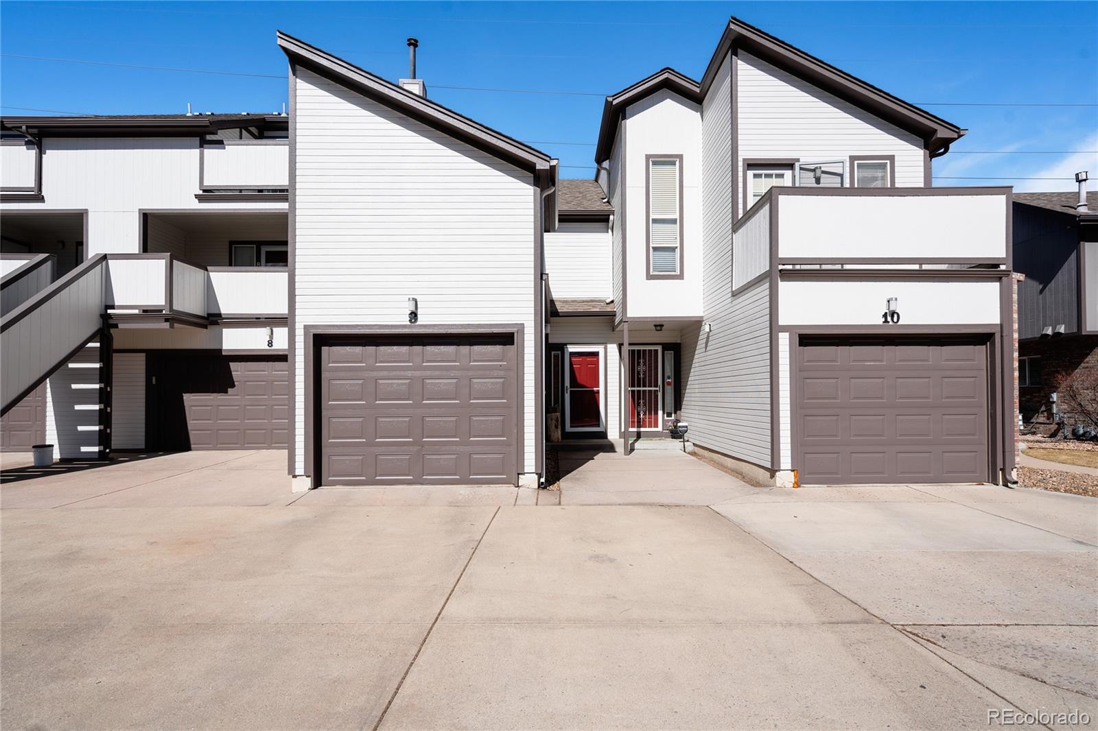 a view of a house with garage and door