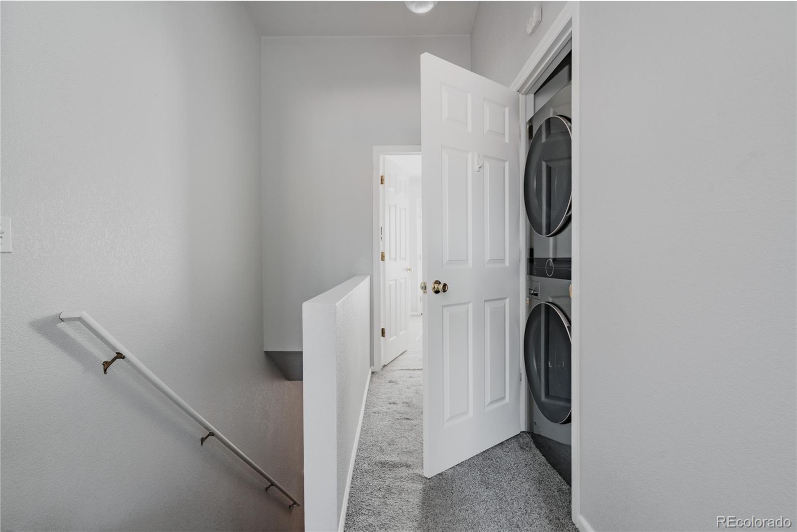 5081 Garrison Street, Unit 9 Wheat Ridge, CO 80033 - Photo 16 of 31 a view of a bathroom from a hallway