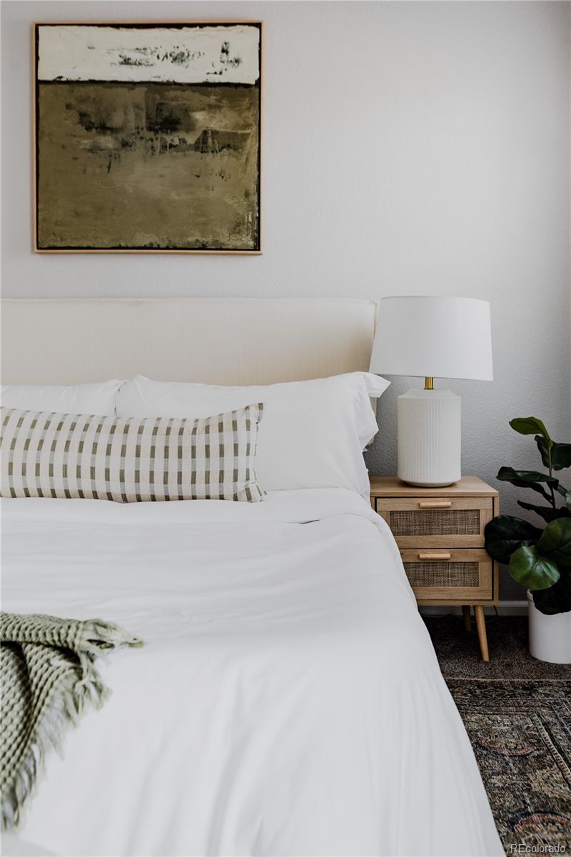 5081 Garrison Street, Unit 9 Wheat Ridge, CO 80033 - Photo 18 of 31 a living room with a couch