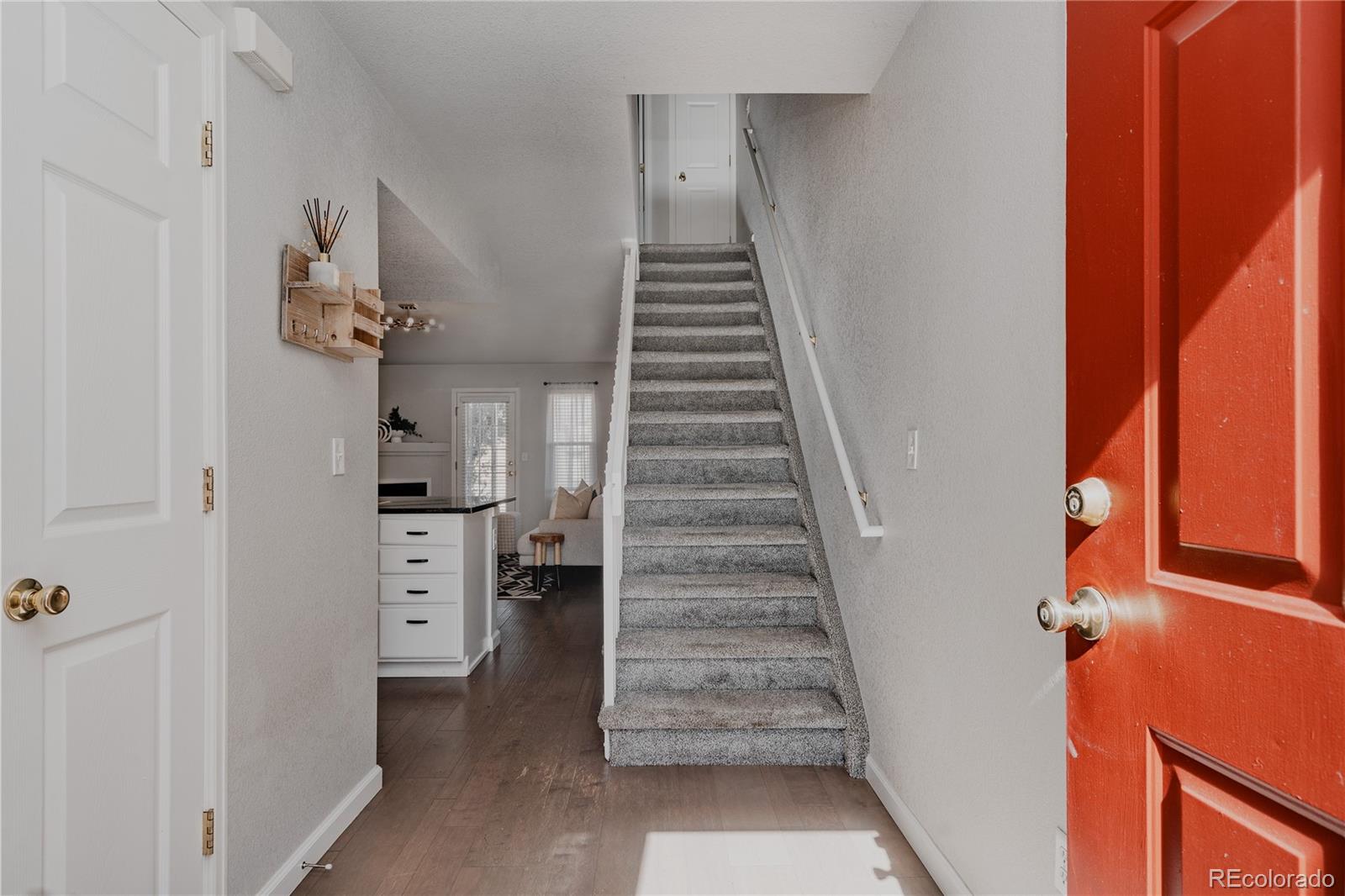 5081 Garrison Street, Unit 9 Wheat Ridge, CO 80033 - Photo 2 of 31 a view of an entryway with stairs