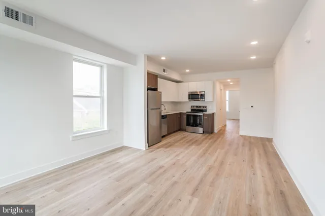 a view of kitchen and wooden floor