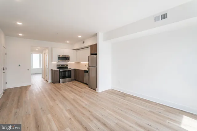 a view of kitchen with wooden floor