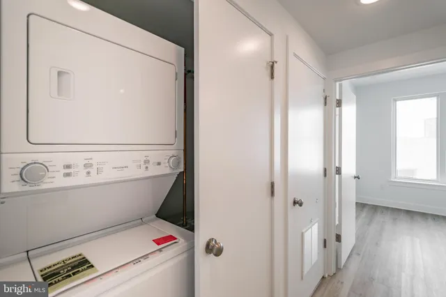 a view of bathroom with a toilet and a mirror