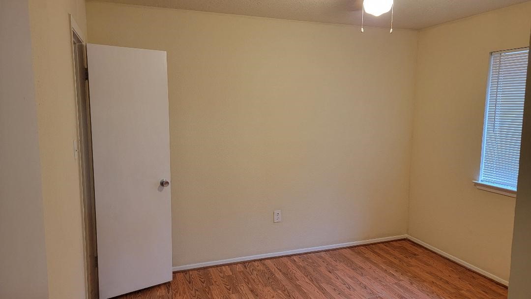 3319 Boxelder Drive Houston, TX 77082 - Photo 8 of 9 a view of small space with wooden floor