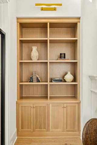 a kitchen with white cabinets and a sink