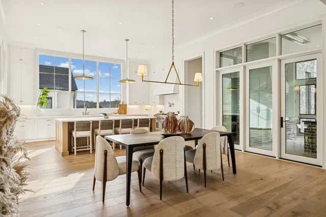 a view of a dining table and chairs in the balcony