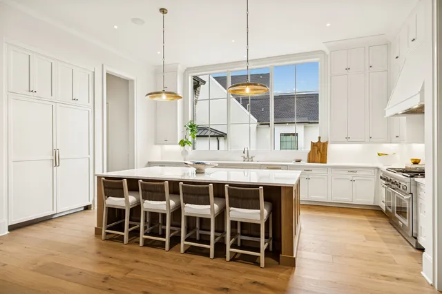 a living room with patio furniture and a fireplace
