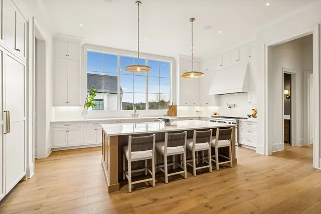 a living room with patio furniture and a yard