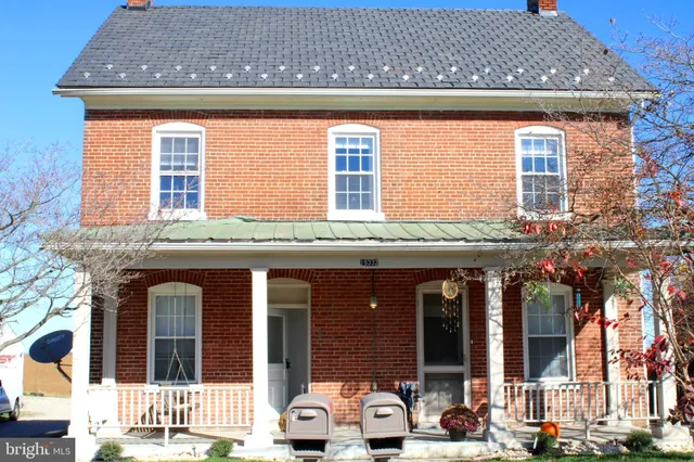 a front view of a house with glass windows